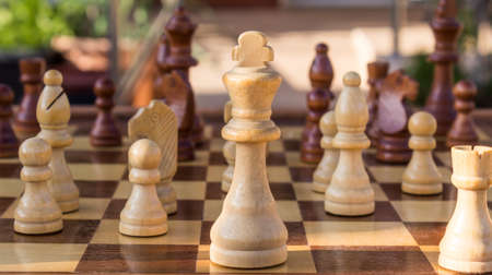 Chess pieces in the middle of a game.の写真素材