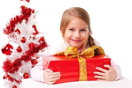 Happy little girl with red presents の写真素材