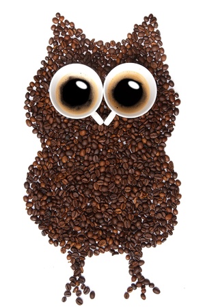 Owl made ââof coffee beans, a cup of coffee with two eyes, isolated background.の写真素材