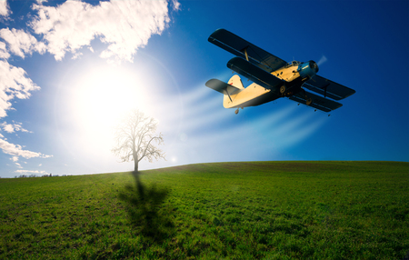 Old airplane in the skyの写真素材