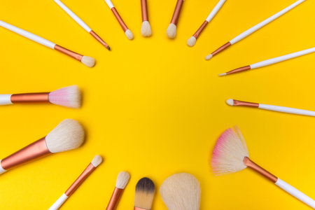 Makeup Brushes circle on yellow background