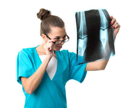 Beautiful radiologist looking at x-ray image