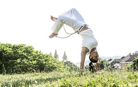 Capoeira woman, awesome stunts in the outdoorsの写真素材