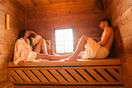 Young couple in saunaの写真素材