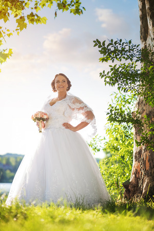 Young beautiful bride in natureの写真素材