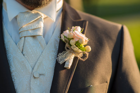 Young handsome groom portrait in nature