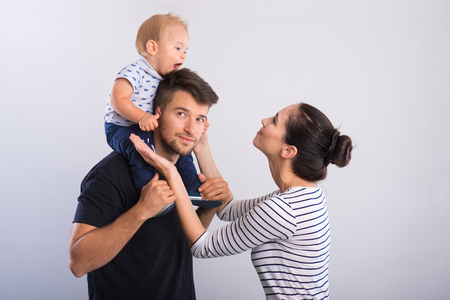 Beautiful young couple with a little boy .の写真素材