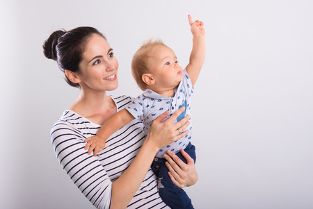 Beautiful young mom with baby .の写真素材