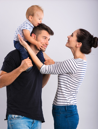 Beautiful young couple with a little boy .の写真素材