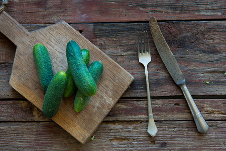 Fresh cucumber on the wood plateの写真素材