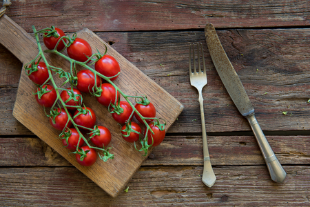 Fresh tomato on the wood plateの写真素材