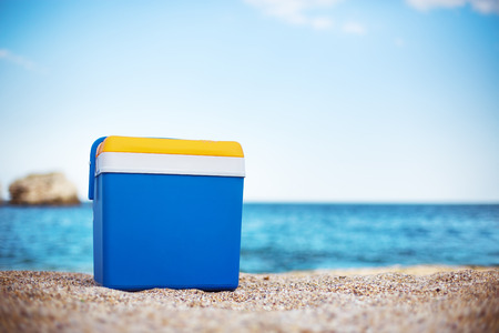 Cooler box on the sea sandの写真素材