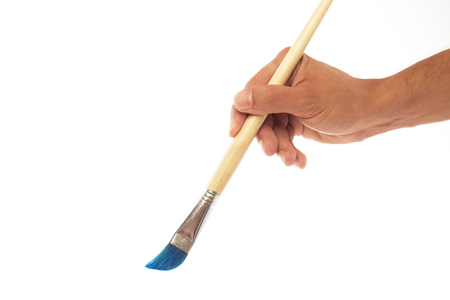 Paintbrush and hand isolated on white backgroundの写真素材
