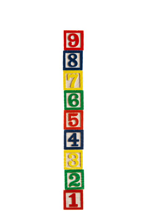 Wooden cubes or toy blocks with numbers isolated on white background