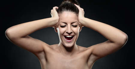 Portrait of Young sexy woman with beautiful body and soft skin, screaming infront of youの写真素材