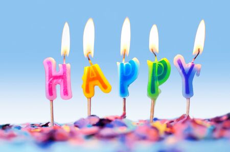 Confetti and birthday candles isolated on white background, party conceptの写真素材