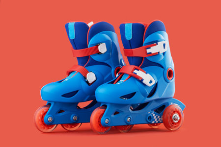 Roller skates isolated on red backgroundの写真素材