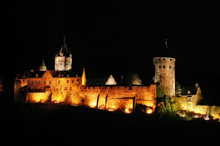 City castle of Altena, Germany illuminated at night. High resolution shot depicting a particularly rustic castle of central Europe. This not-so-famous castle brings a lot of medieval atmosphere to any design purpose...の写真素材