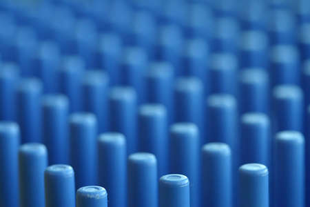 A closeup of a lab dish holder. Image has abstract qualities through its shallow DOF and repetitive rhythm. Could be used as a background for powerpoint slides for example.の写真素材