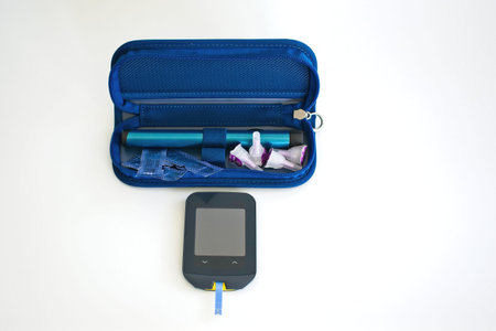 Diabetes test kit and insulin pen.