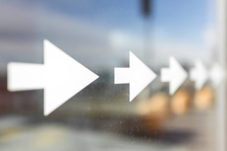 Long row of arrows stickers on a dirty window.の写真素材