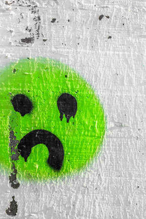 Sadness and tears represented in a graffiti on the wall.の写真素材