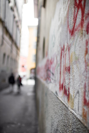 Two mysterious shadows roam an alley.の写真素材