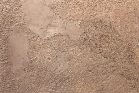 An old wall with plaster irregular coarse.の写真素材