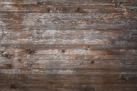Planks of rustic wood with dark brown tones.の写真素材