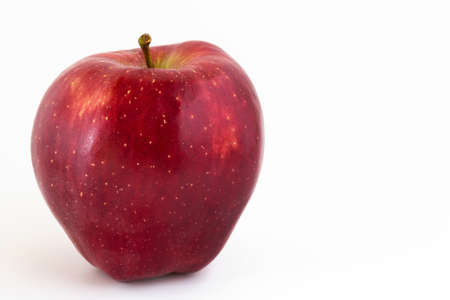 Close-up of a red apple on white background and copy space.の写真素材