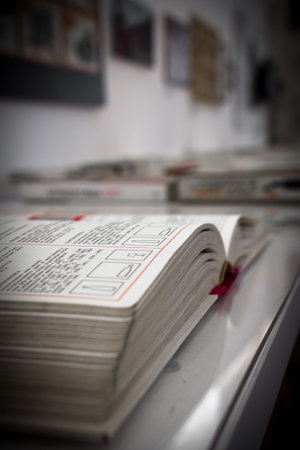 Extreme close-up of an open book, on blurred background.の写真素材