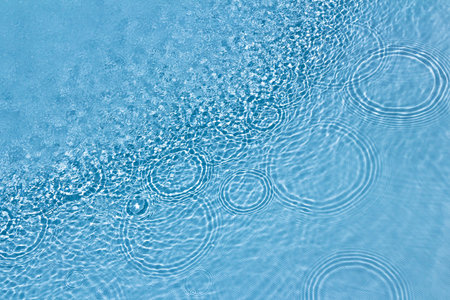 Designs and shapes on the water surface of a pool.