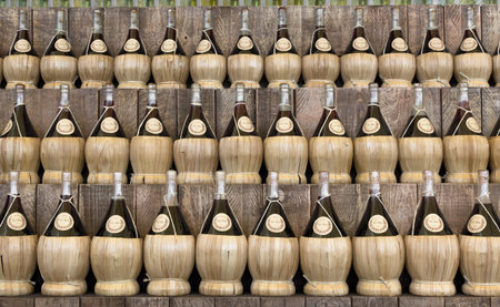 Front view of a series of jars for wine, arranged in a row on three levels.の写真素材