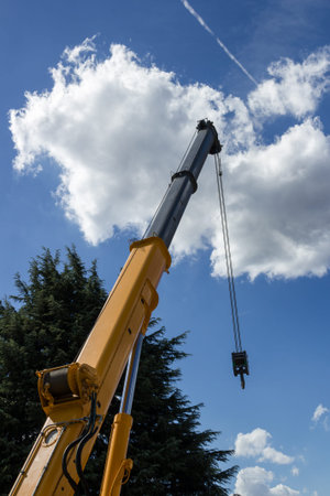 A construction crane with blue sky in the background.