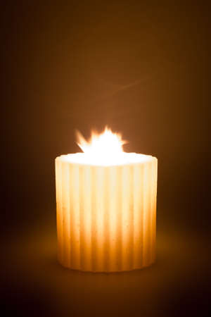 Christmas candle made with raw wax, wrapped in a soft atmosphere.の写真素材