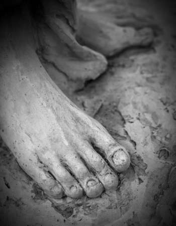 Detail of a marble statue, depicting the foot of the suffering Christの写真素材
