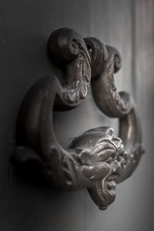 Door Knocker on the door of an old buildingの写真素材