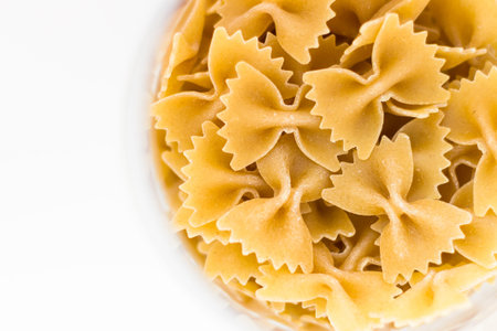 Detail of a plate of whole wheat pasta with soft edges and copyspace.の写真素材