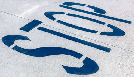 Word "STOP" written on an the roadの写真素材