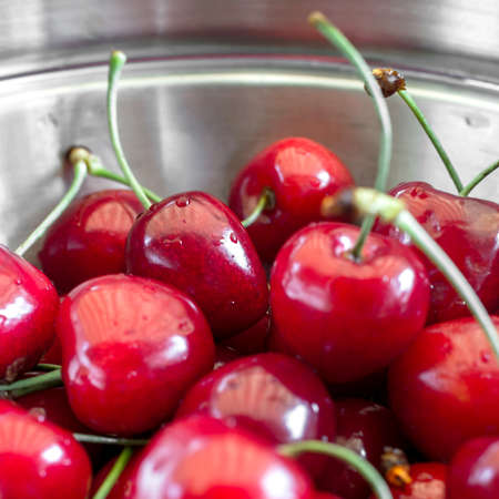 Close up of red cherries with drops for backgroundの写真素材