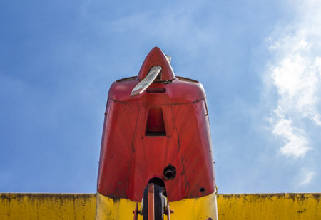 Vintage airplane seen from below, with blue sky in the background