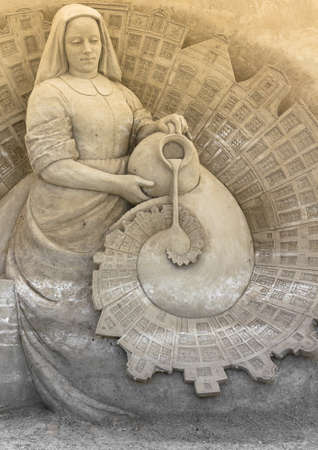 Sand sculpture of a peasant woman with a jarの写真素材