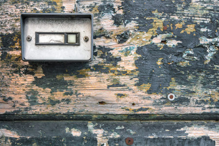 Retro doorbell on old wood doorの写真素材