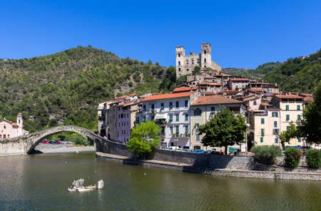 Dolceacqua, Imperia. Liguria (ITALY). The Monet's Bridge on the River Nervia. On the hill is located the Doria's castle.のeditorial素材
