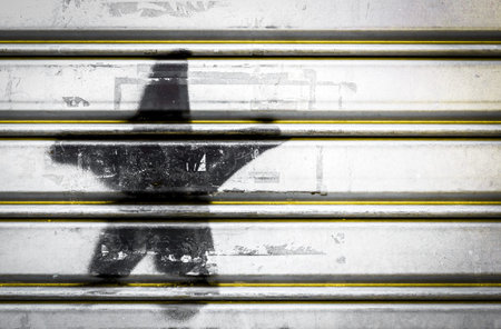 Black star on grunge roller shutter. For backgrounds, abstract wallpaper, textures and more.の写真素材