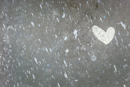 White heart painted on recycled cardboard with paint splatters everywhere. It can be used as a poster, wallpaper, design t-shirts. Fully editable.の写真素材
