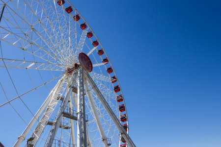 Jesolo, Italy, July 19 2016: ferris wheel on blue sky background.のeditorial素材