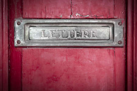 Vintage grunge letter box on wooden doorの写真素材