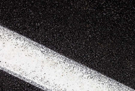 Tarmac background and texture. White line on road.の写真素材