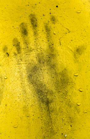 Grungy wall with hand print. It can be used as a backdrop, grungy wallpaper, design t-shirts and more. Fully editable.の写真素材
